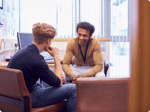 Two employees having a conversation in the workplace