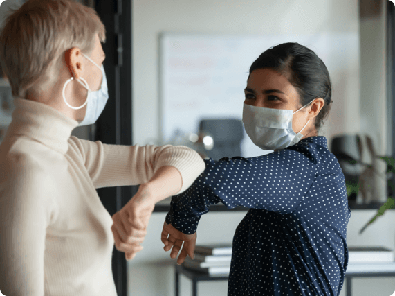 Two employees wearing masks