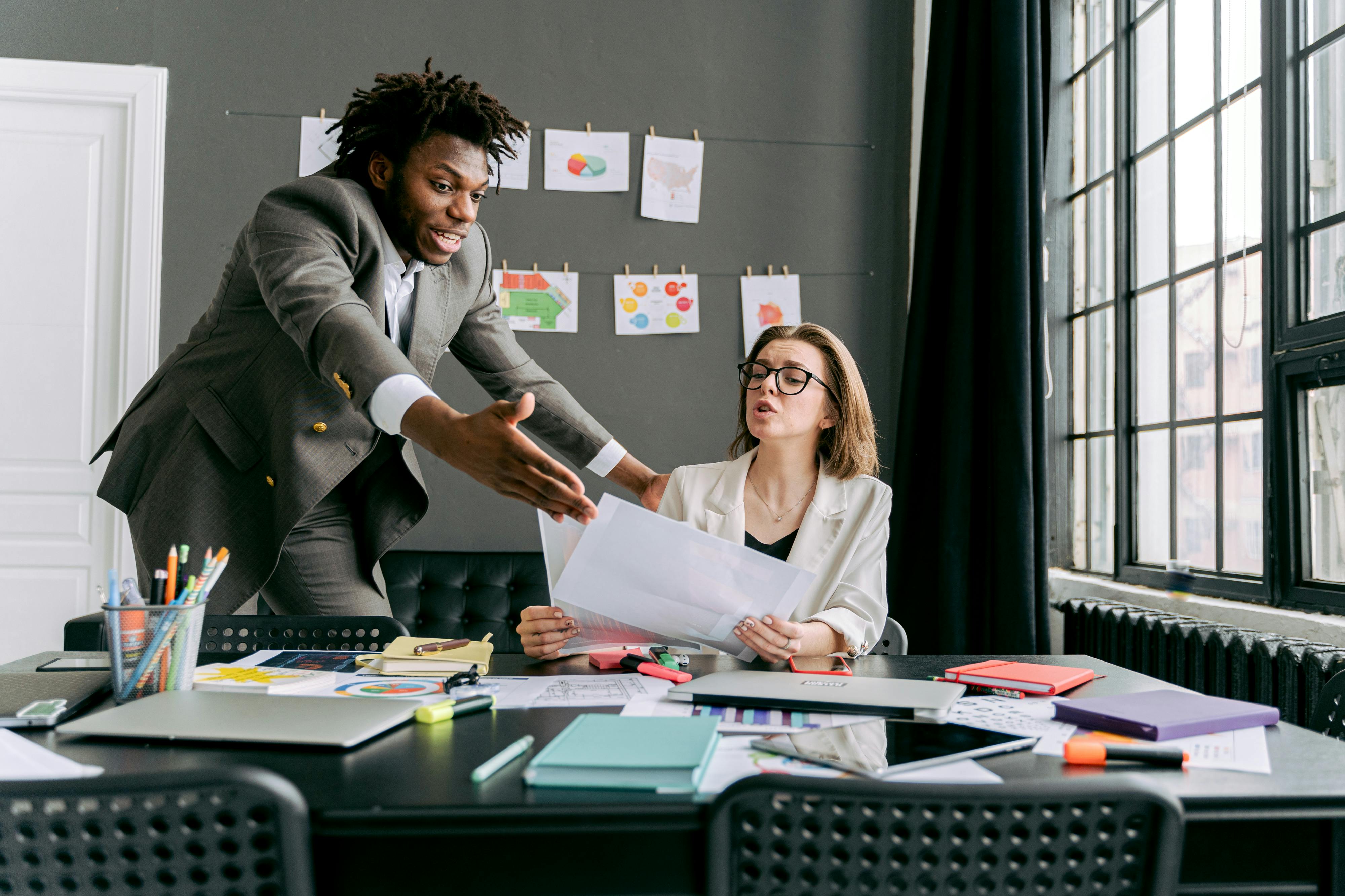 man and women argue at the office